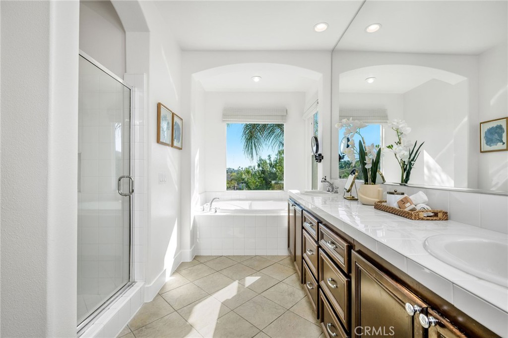 1204 Vista Jardin San Clemente, CA 92673 - Photo 32 of 55 a bathroom with a sink a large mirror and a bathtub