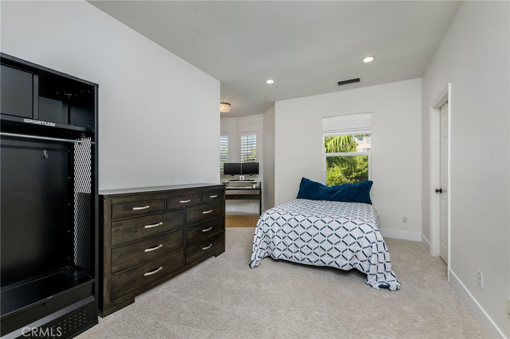 1204 Vista Jardin San Clemente, CA 92673 - Photo 35 of 55 a bedroom with a bed and a dresser