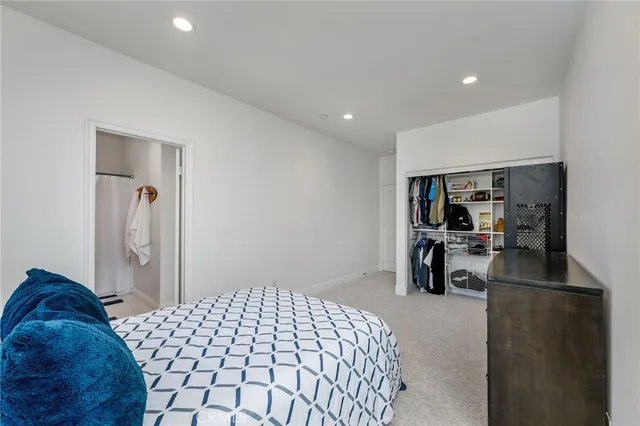 an empty room with a bathroom and a sink