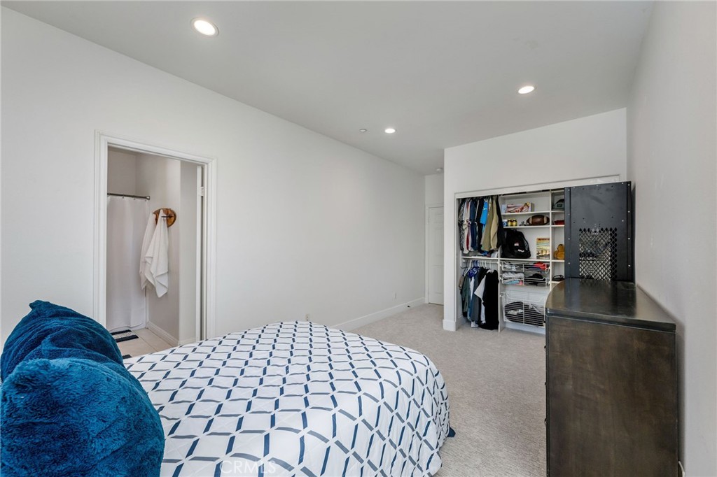 1204 Vista Jardin San Clemente, CA 92673 - Photo 37 of 55 a bedroom with a bed and a large mirror