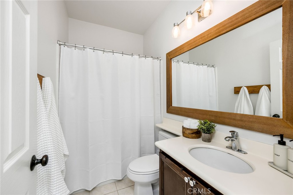 1204 Vista Jardin San Clemente, CA 92673 - Photo 42 of 55 a bathroom with a sink vanity mirror and toilet