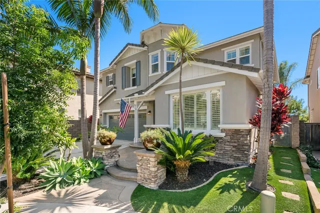 an aerial view of residential houses with outdoor space and street view