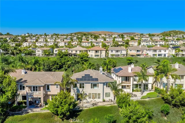 an aerial view of a house with a yard and garden