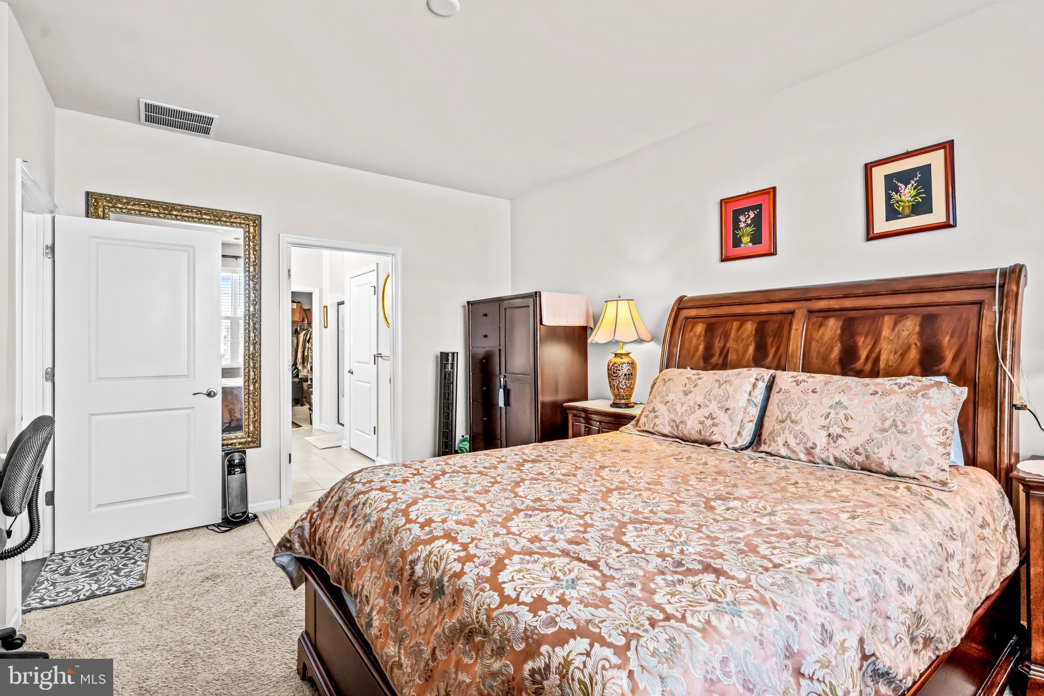 74 Walton Way Delanco, NJ 08075 - Photo 11 of 21 a large bed sitting in a bedroom and a table