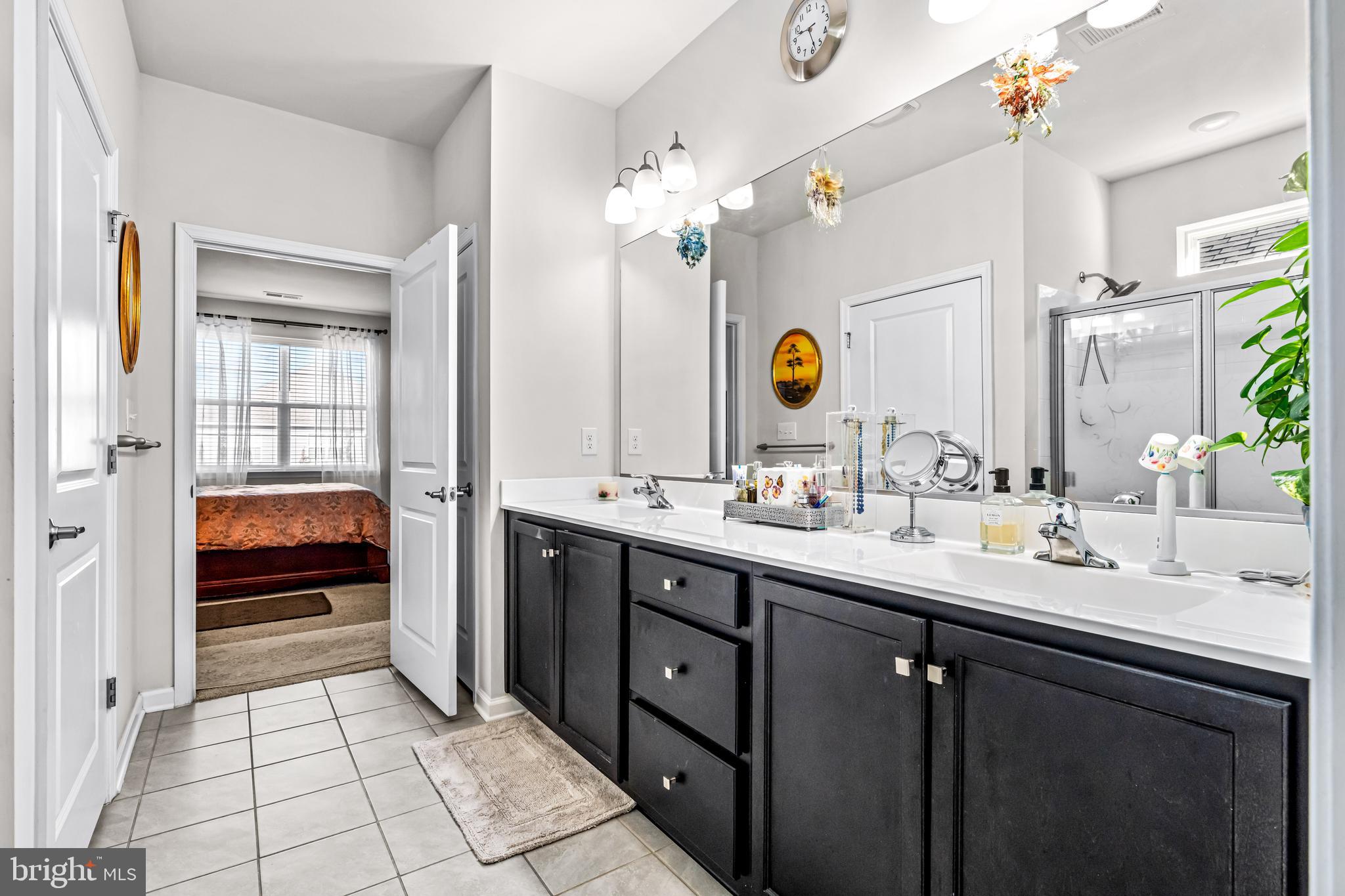 74 Walton Way Delanco, NJ 08075 - Photo 13 of 21 a en suite bathroom with a double vanity sink a mirror and a shower