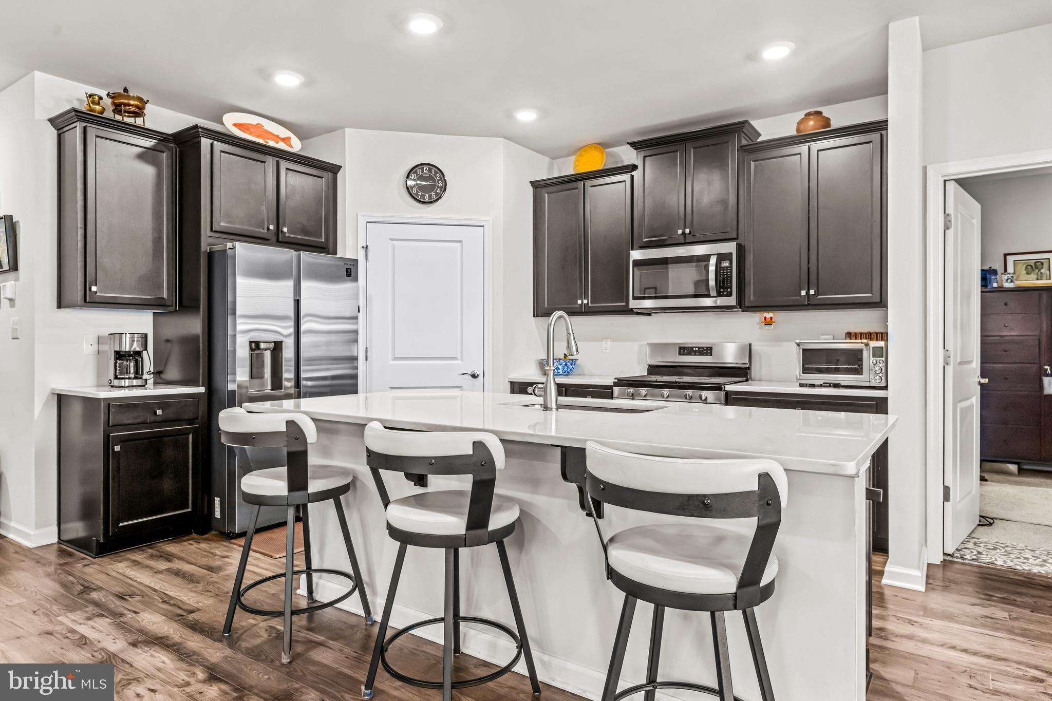 74 Walton Way Delanco, NJ 08075 - Photo 6 of 21 a kitchen with stainless steel appliances kitchen island granite countertop a refrigerator and microwave