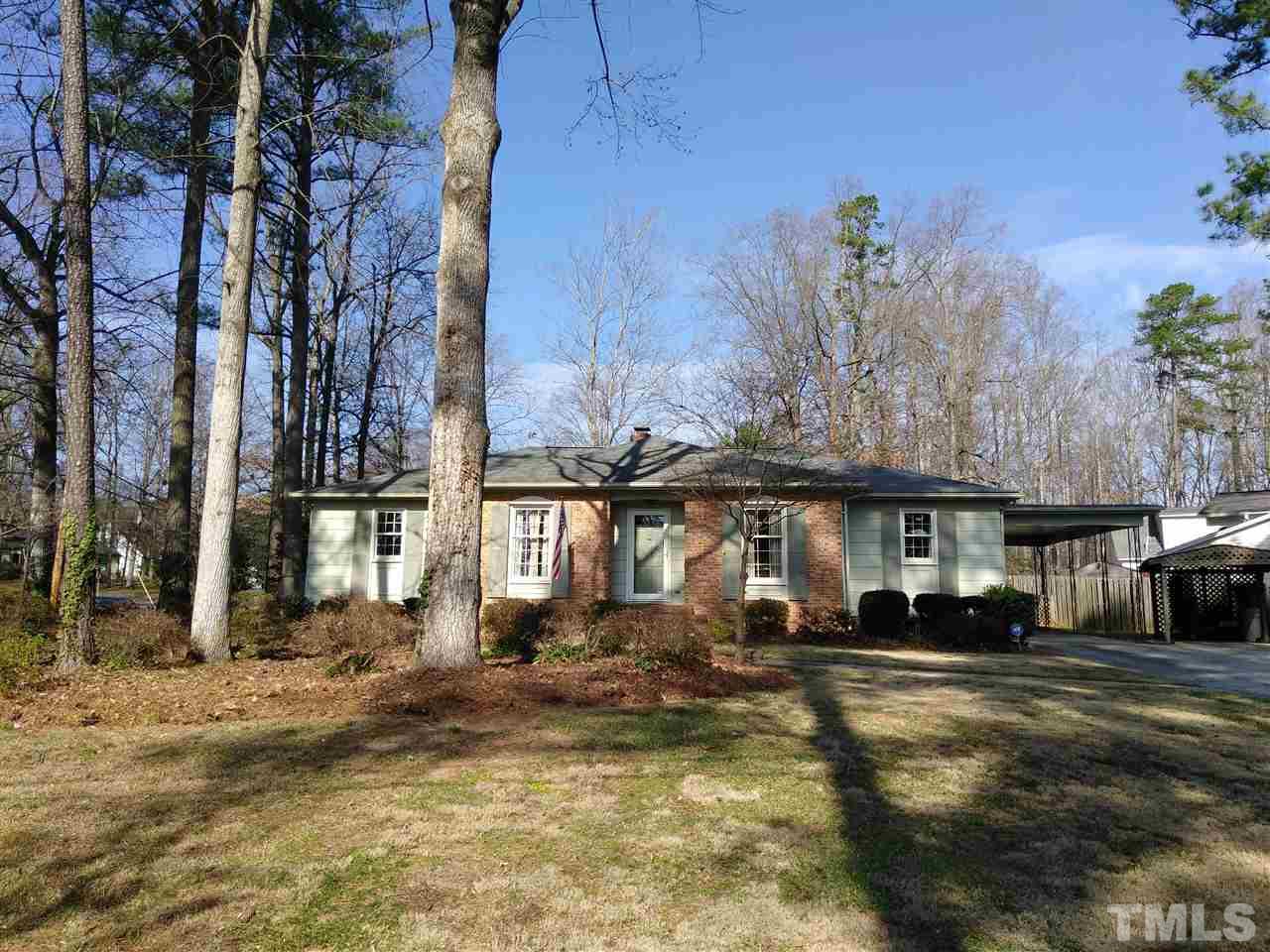 4101 Amherst Lane Raleigh, NC 27609 - Photo 1 of 17 a front view of a house with a yard