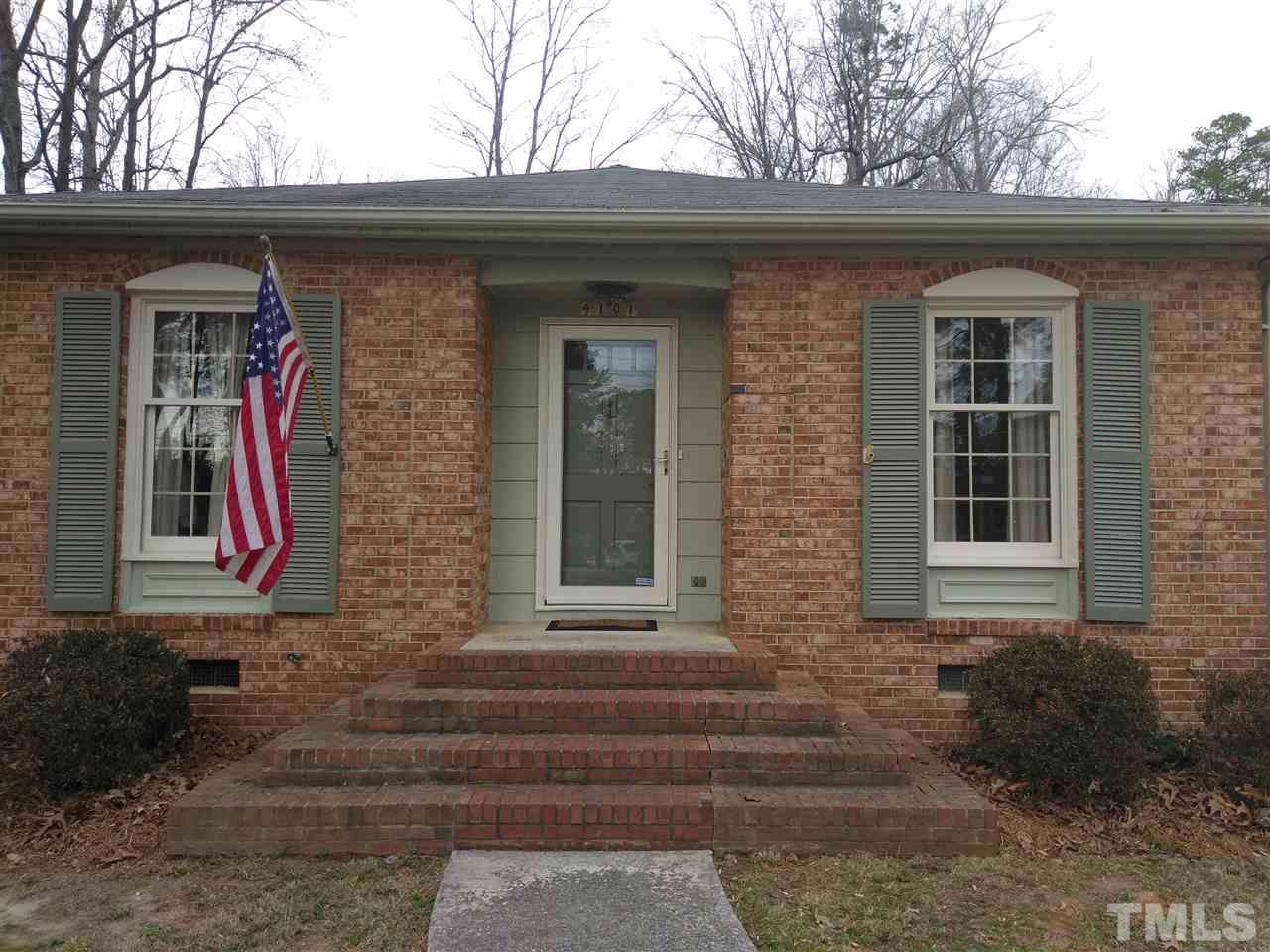 4101 Amherst Lane Raleigh, NC 27609 - Photo 2 of 17 a front view of a house with a yard