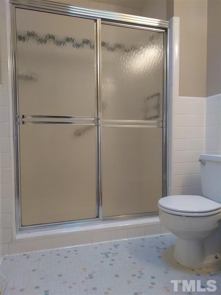 4101 Amherst Lane Raleigh, NC 27609 - Photo 17 of 17 a bathroom with a toilet and a shower