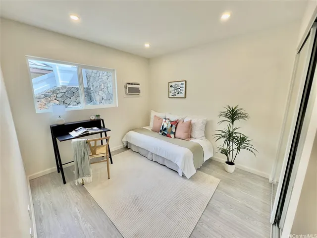 a bedroom with a bed and a couch