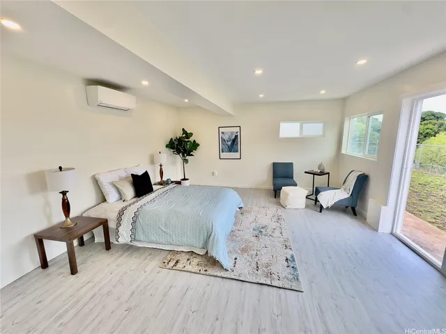 a bedroom with bed and a window