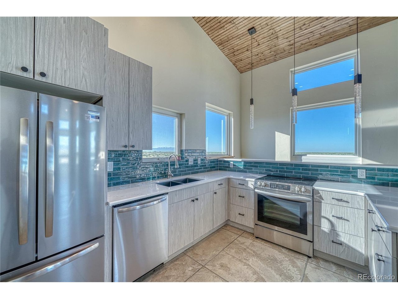 57884 Co Road Moffat, CO 81143 - Photo 11 of 39 Kitchen with Colorful Backsplash