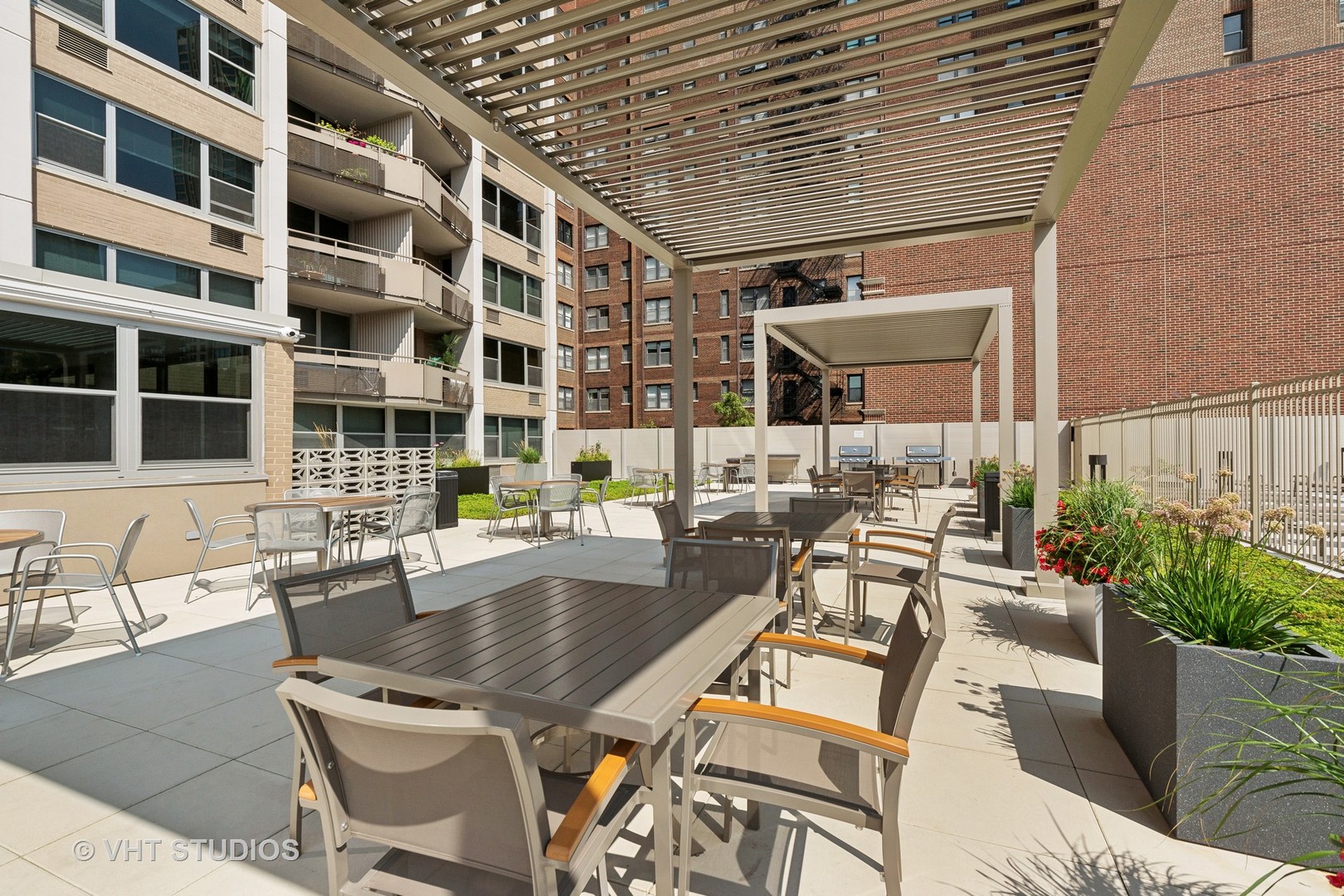 555 West Cornelia Avenue, Unit 412 Chicago, IL 60657 - Photo 14 of 20 a view of a patio with couches and potted plants