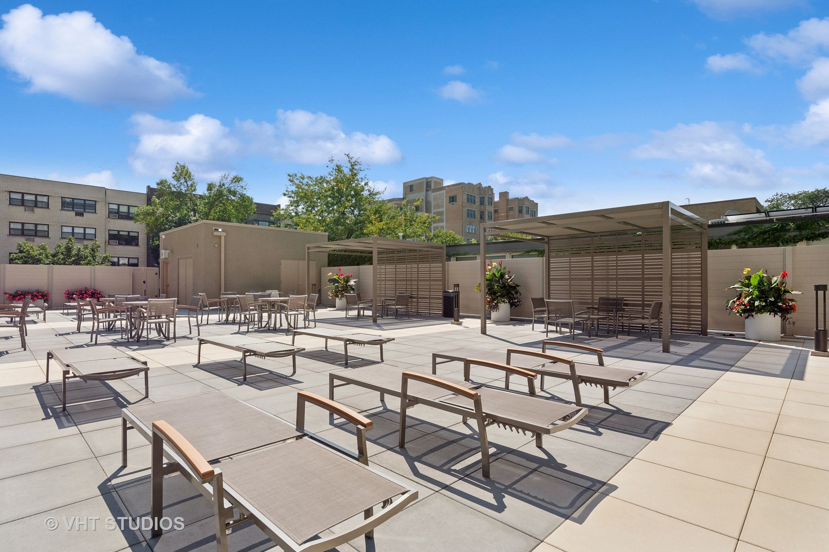 555 West Cornelia Avenue, Unit 412 Chicago, IL 60657 - Photo 17 of 20 a view of a terrace with furniture and a table