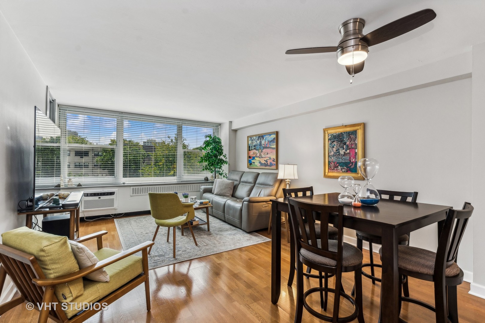 555 West Cornelia Avenue, Unit 412 Chicago, IL 60657 - Photo 2 of 20 a view of a dining room with furniture window and outside view