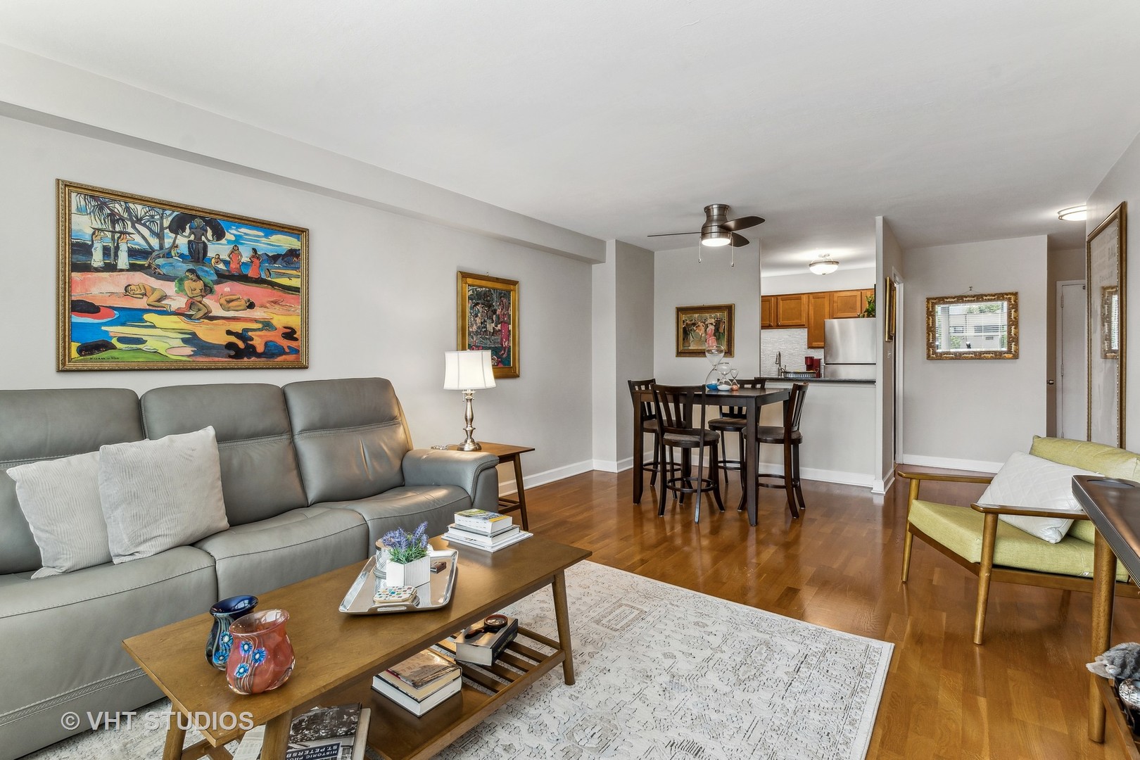 555 West Cornelia Avenue, Unit 412 Chicago, IL 60657 - Photo 4 of 20 a living room with furniture and wooden floor