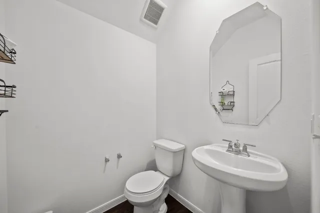 a bathroom with a sink and a toilet
