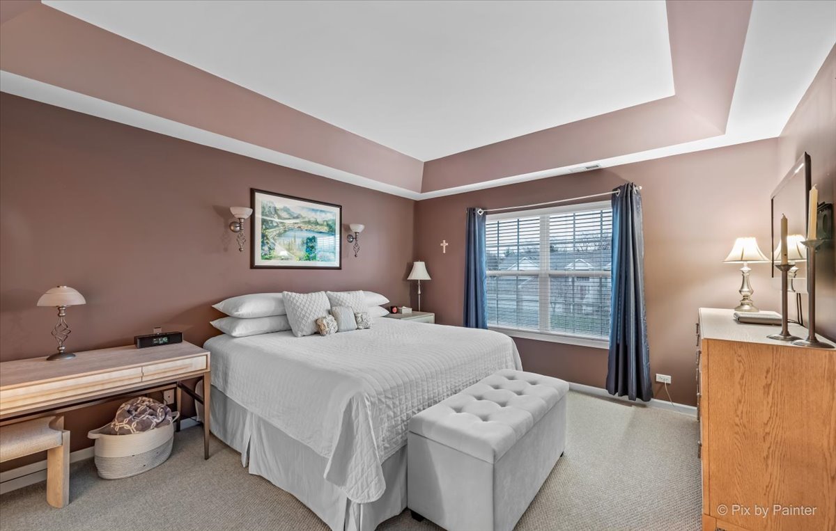 845 Riding Lane St. Charles, IL 60174 - Photo 17 of 32 a bedroom with a bed and a night stand