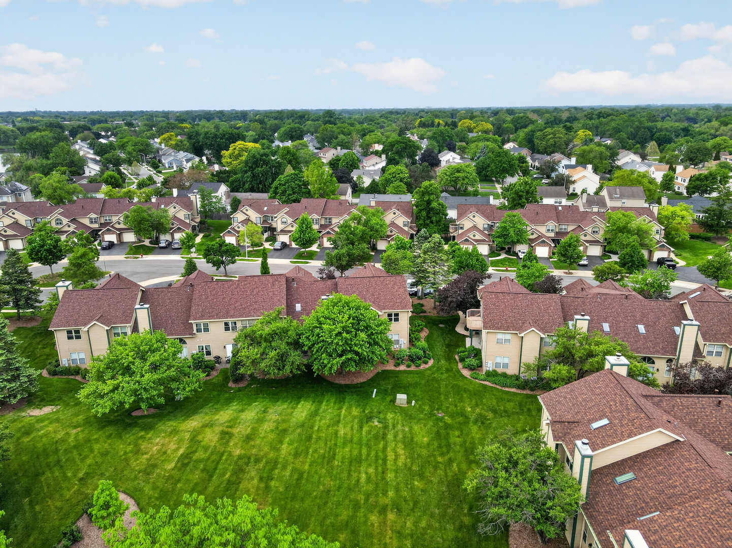 943 Ridgefield Lane, Unit 4 Wheeling, IL 60090 - Photo 31 of 38 an aerial view of residential houses with outdoor space and trees all around