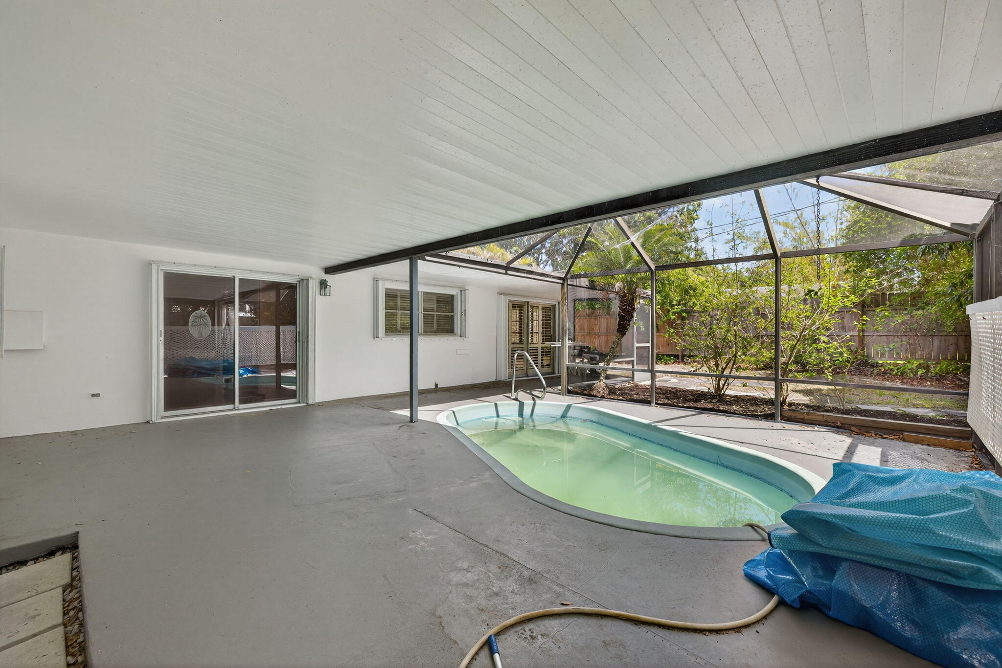 1040 Southeast 5th Street Stuart, FL 34996 - Photo 11 of 21 a swimming pool with outdoor seating and yard