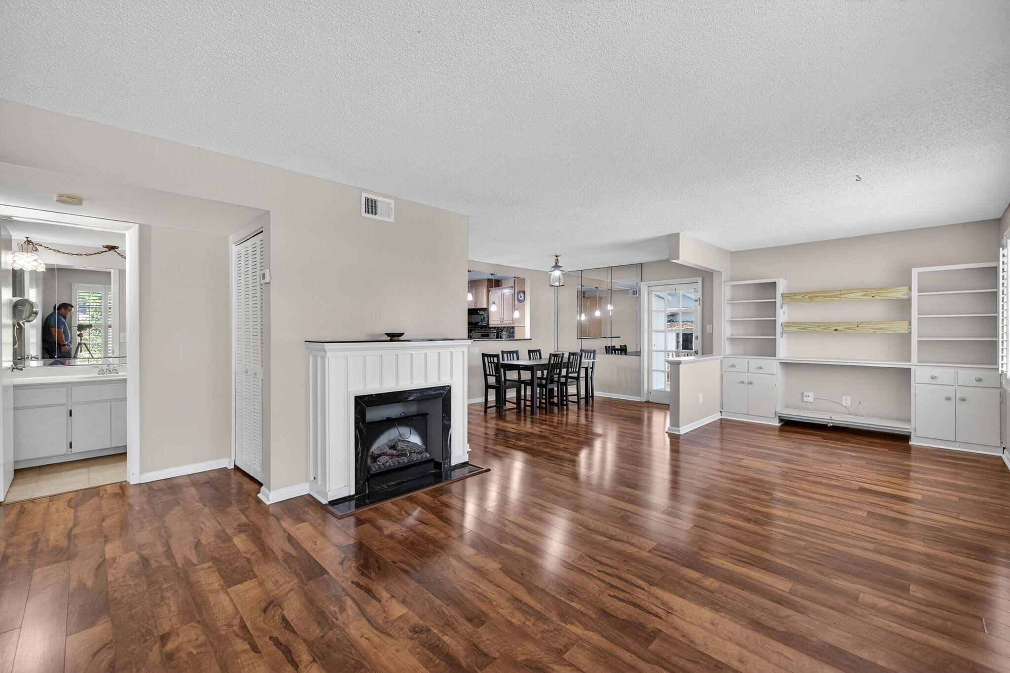1040 Southeast 5th Street Stuart, FL 34996 - Photo 2 of 21 a view of a livingroom with furniture a fireplace and wooden floor