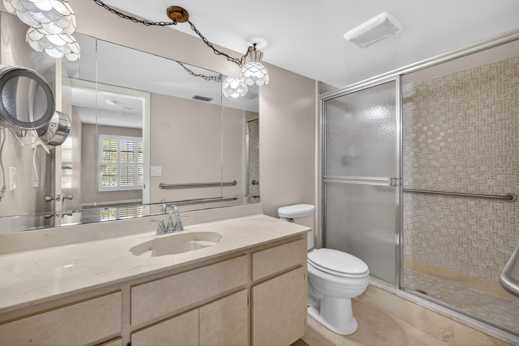 1040 Southeast 5th Street Stuart, FL 34996 - Photo 7 of 21 a bathroom with a sink a toilet and shower