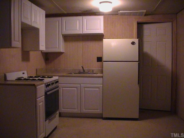 5405 Castlebrook Drive Raleigh, NC 27604 - Photo 12 of 12 Apartment, view toward kitchen end with bathroom door to the right.