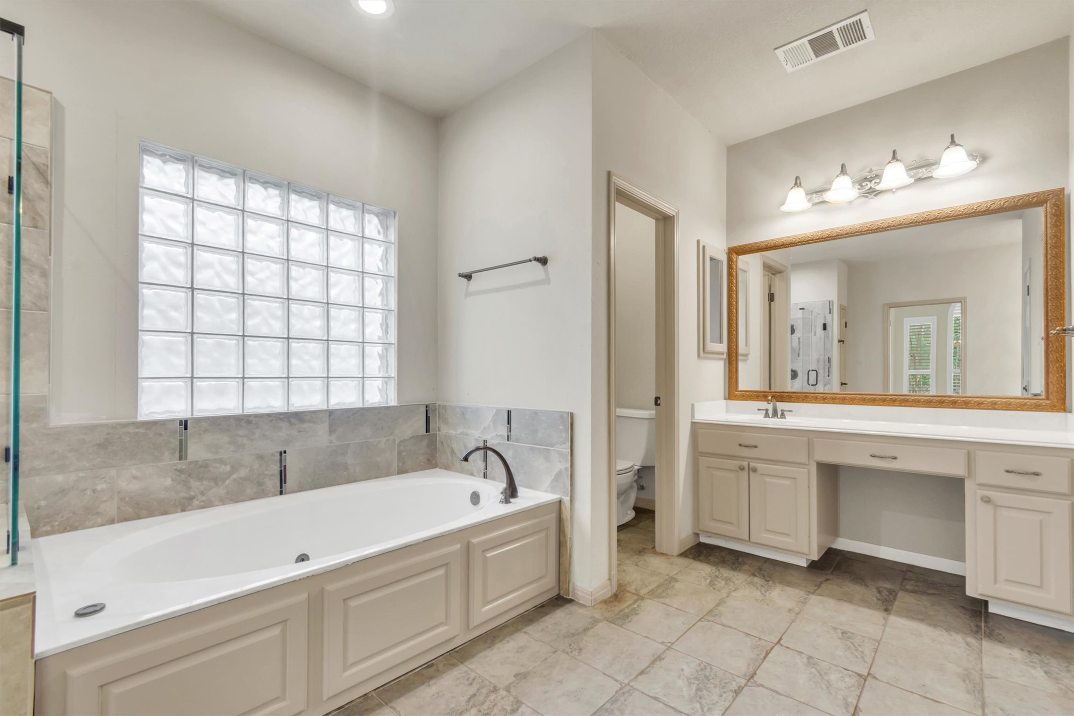 6008 Tributary Ridge Court Austin, TX 78759 - Photo 15 of 36 Well-appointed bath, featuring a large soaking tub.