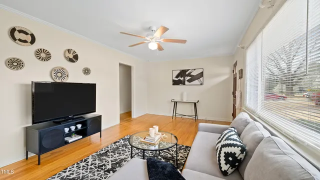 a living room with furniture and a flat screen tv