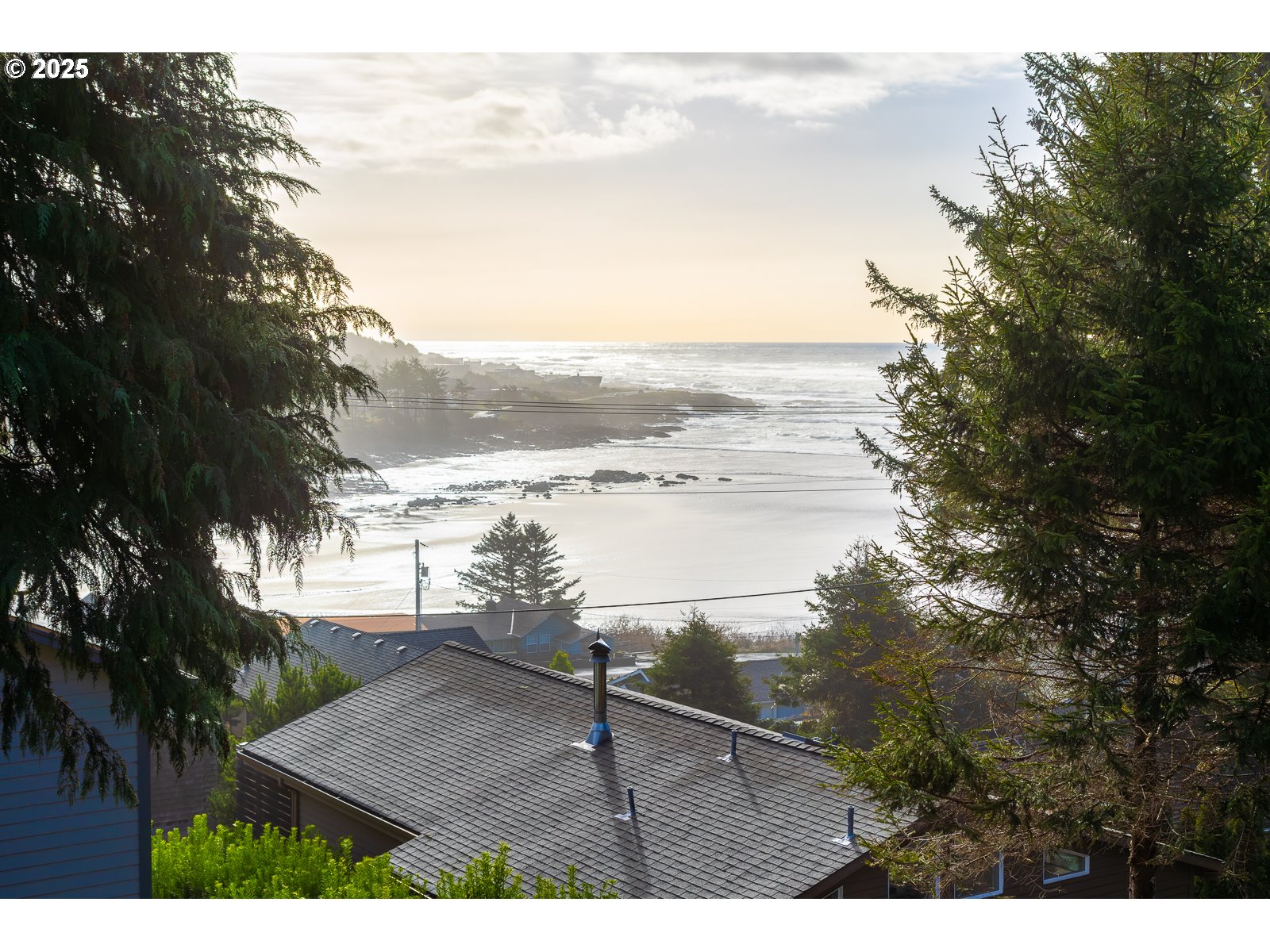 1701 East 3rd Street Yachats, OR 97498 - Photo 5 of 11 a view of a lake from a yard