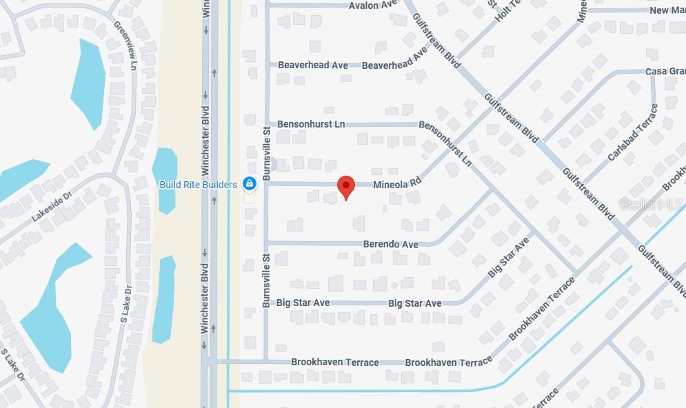 7278 Mineola Road Englewood, FL 34224 - Photo 5 of 6 a white cabinet sitting next to a white wall