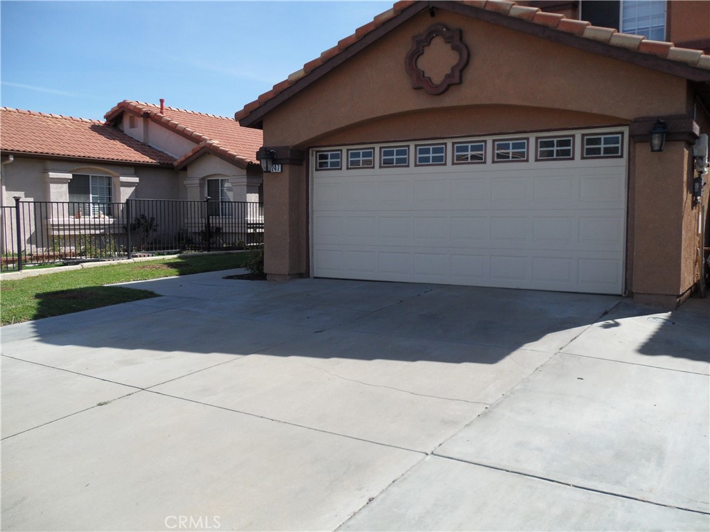 2247 Firebrand Avenue Perris, CA 92571 - Photo 3 of 36 a front view of a house with a yard