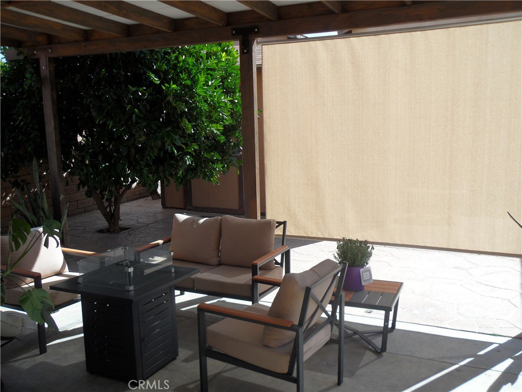 2247 Firebrand Avenue Perris, CA 92571 - Photo 32 of 36 a outdoor living space with furniture and a potted plant