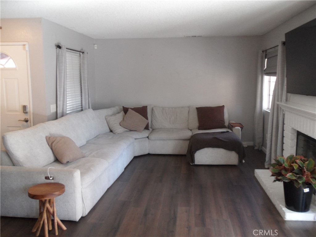 2247 Firebrand Avenue Perris, CA 92571 - Photo 4 of 36 a living room with furniture and a fireplace