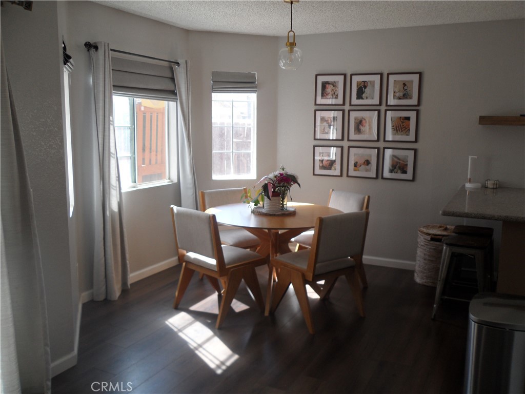 2247 Firebrand Avenue Perris, CA 92571 - Photo 7 of 36 a view of a dining room with furniture window and wooden floor