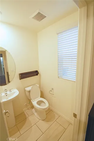 a bathroom with a toilet and a sink