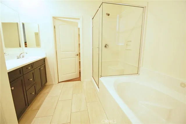 a bathroom with a shower and a sink