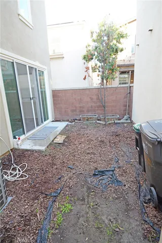 a view of a room that has a bed and a window