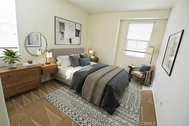 a bed room with a bed mirror and a window