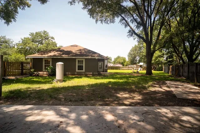 a view of a backyard with a small cabin