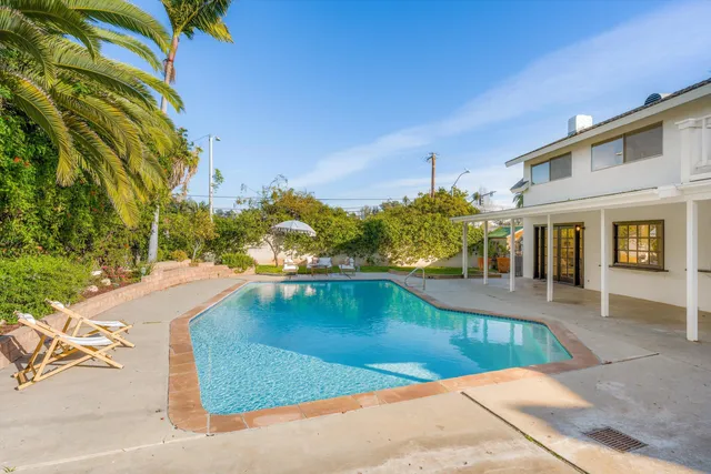 a view of a swimming pool with a patio