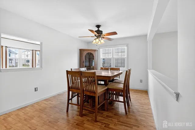 a dining room with furniture a rug and a chandelier