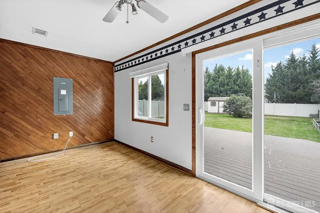 a spacious bedroom with a bed and a window