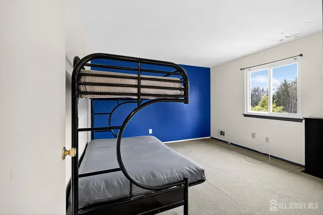 a bedroom with a bed and a table