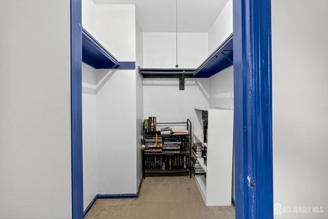 a view of storage and utility room with washer and dryer