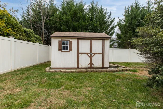 an aerial view of a house with a lake view