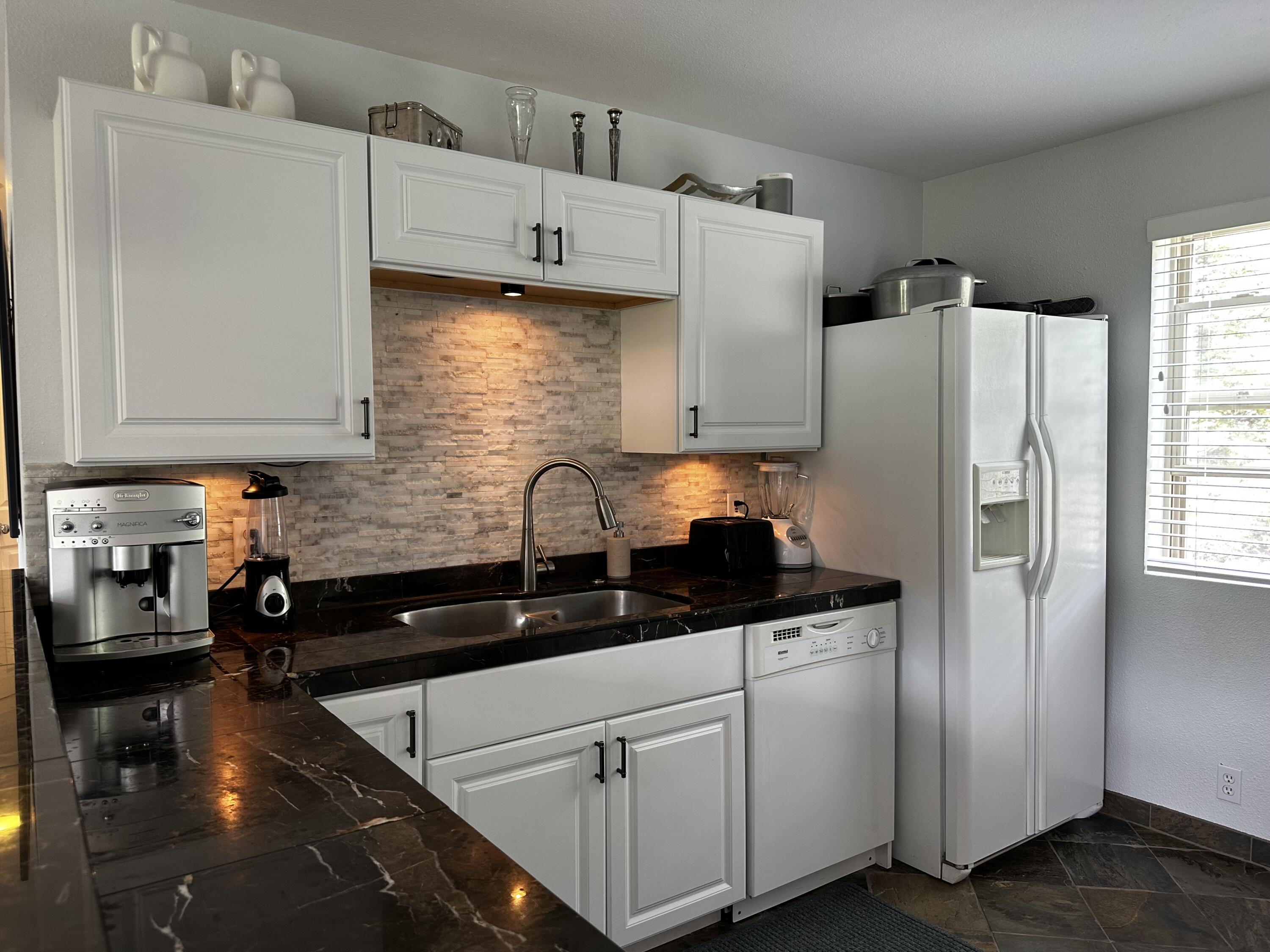 327 Adams Ranch Road, Unit 302 Mountain Village, CO 81435 - Photo 1 of 17 Kitchen sink IMG_3332