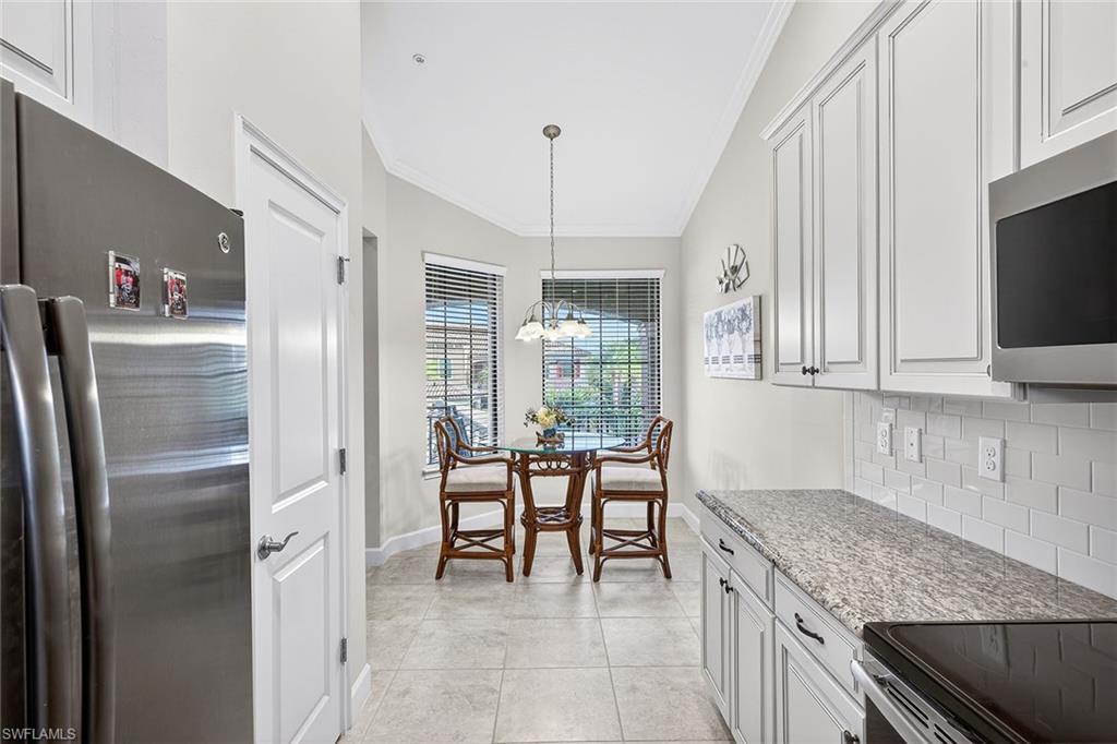 9419 Benvenuto Court, Unit 202 Naples, FL 34119 - Photo 14 of 44 Kitchen and Breakfast Nook