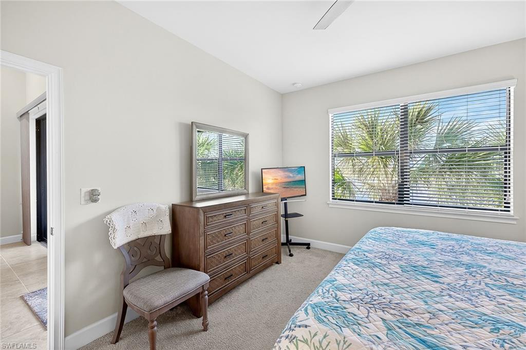 9419 Benvenuto Court, Unit 202 Naples, FL 34119 - Photo 17 of 44 Primary Bedroom