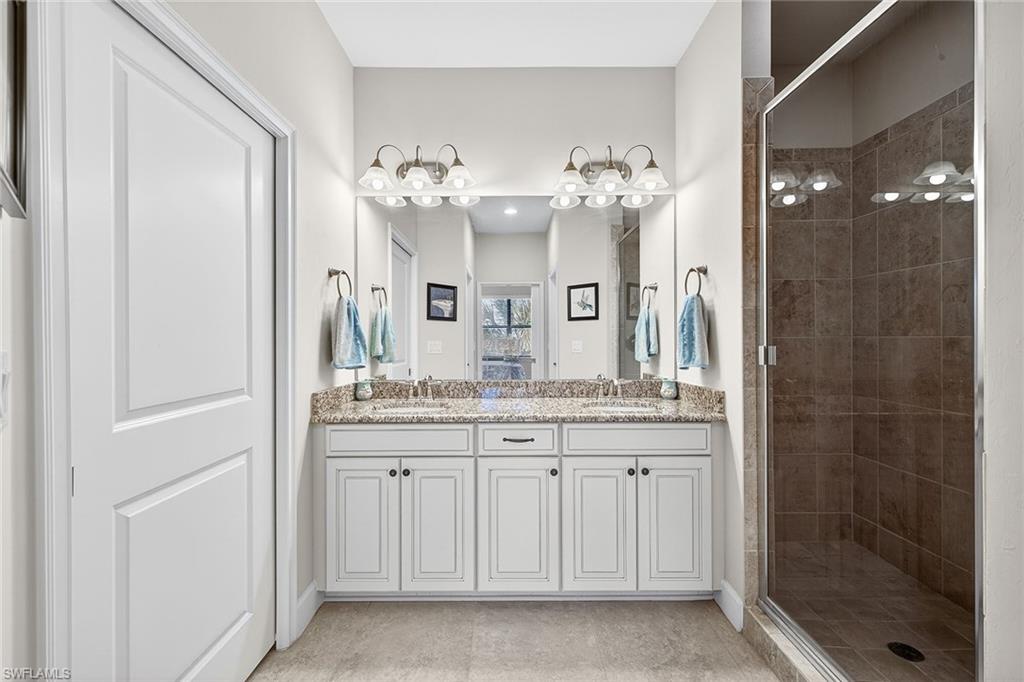 9419 Benvenuto Court, Unit 202 Naples, FL 34119 - Photo 18 of 44 Primary Bath